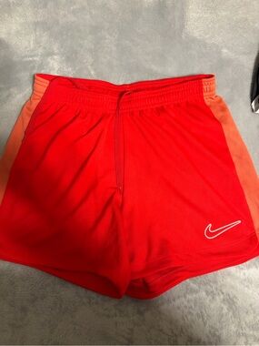 Nike Women’s Red Athletic Shorts with Orange Side Panels